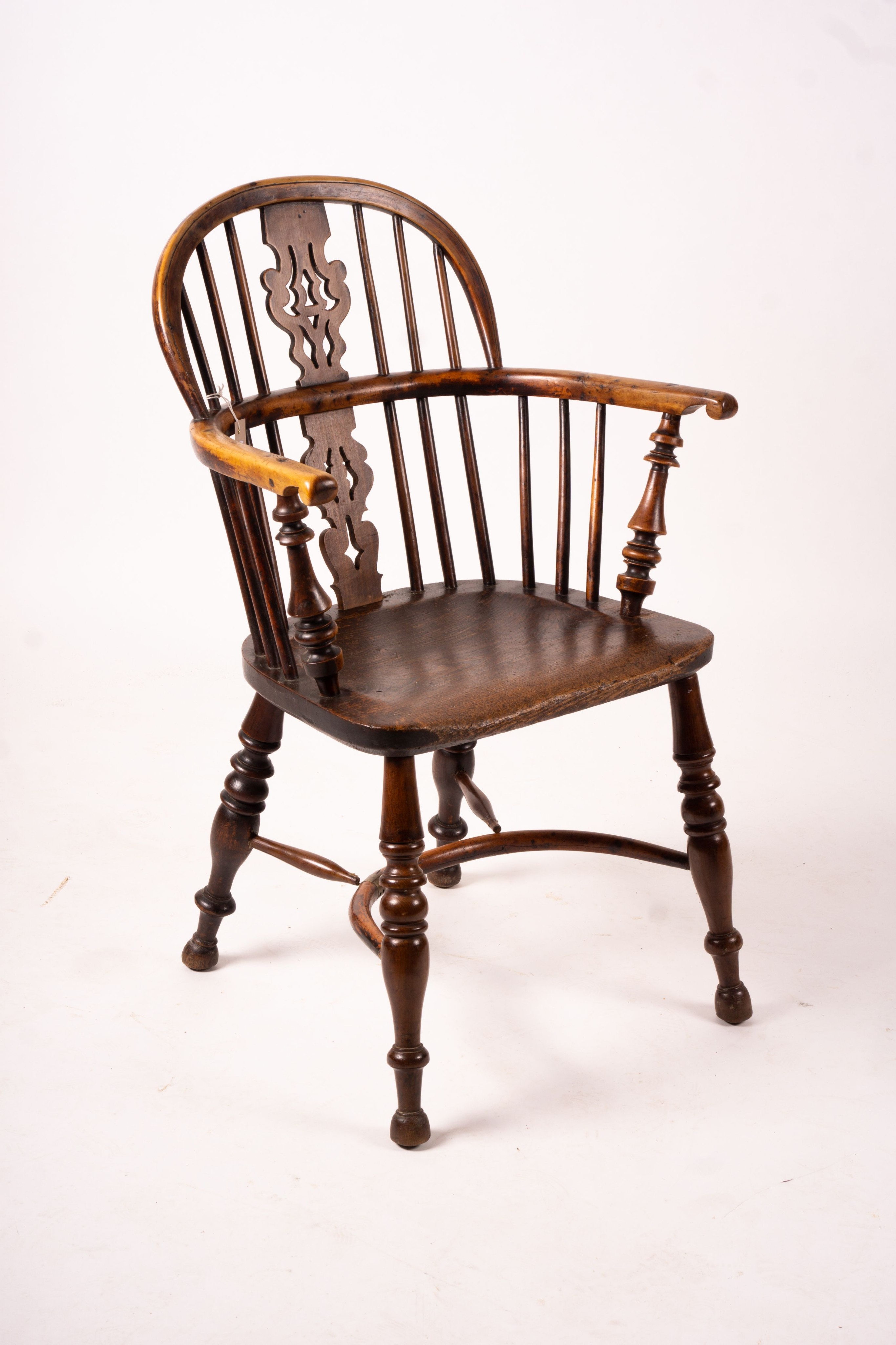 A 19th century yew and elm Yorkshire area Windsor elbow chair with crinoline stretcher, width 60cm, depth 45cm, height 93cm